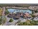 Aerial view of the community clubhouse with a luxurious pool and surrounding condos at 5766 Lesabre Dr, Kissimmee, FL 34746