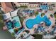 Aerial view of the resort's expansive pool area, featuring multiple pools, a waterslide, and lounge areas at 5766 Lesabre Dr, Kissimmee, FL 34746