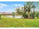 Beautiful backyard of townhomes with pond creating a serene outdoor space at 5766 Lesabre Dr, Kissimmee, FL 34746