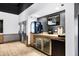 The bar offers beverage coolers, countertop, and modern decor for a relaxing and enjoyable experience at 5766 Lesabre Dr, Kissimmee, FL 34746
