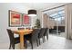 Bright and airy dining area featuring a wooden table and chairs with a view of the screened patio at 5766 Lesabre Dr, Kissimmee, FL 34746
