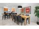 Well-lit dining area adjacent to a kitchen island, perfect for Gathering meals and entertaining at 5766 Lesabre Dr, Kissimmee, FL 34746