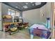 The game room features air hockey and racing games for added excitement and entertainment at 5766 Lesabre Dr, Kissimmee, FL 34746