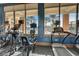 Stay active in the gym with modern equipment and scenic views overlooking the pool and palm trees at 5766 Lesabre Dr, Kissimmee, FL 34746