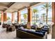 Relax in the elegant lounge area with comfortable seating, stylish decor, and scenic views of the pool at 5766 Lesabre Dr, Kissimmee, FL 34746