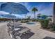Relaxing pool area offers lounge chairs, umbrellas, and a hot tub for ultimate comfort at 5766 Lesabre Dr, Kissimmee, FL 34746