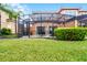 Inviting screened patio with outdoor seating, perfect for enjoying the Florida weather at 5766 Lesabre Dr, Kissimmee, FL 34746