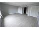 Spacious bedroom featuring tile floors, neutral paint, and a closet space at 6046 Village Cir # 6046, Orlando, FL 32822