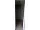 Walk-in closet featuring wood flooring, shelves, and neutral paint at 6046 Village Cir # 6046, Orlando, FL 32822