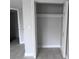 View of the closet featuring tile floors, neutral paint, and a functional design at 6046 Village Cir # 6046, Orlando, FL 32822