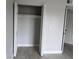 Spacious bedroom closet with built-in shelving and plenty of room for storage at 6046 Village Cir # 6046, Orlando, FL 32822