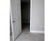 Bedroom view into the closet featuring built-in storage at 6046 Village Cir # 6046, Orlando, FL 32822