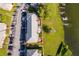 Aerial view of condo building with waterfront location, parking, and the listing outlined in red at 620 Georgetown Dr # 620, Casselberry, FL 32707