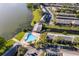 Aerial view of condo buildings and a communal pool with waterfront location on lake at 620 Georgetown Dr # 620, Casselberry, FL 32707