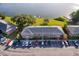 Aerial view of the brick condo complex with lake view and marked listing with red outline at 620 Georgetown Dr # 620, Casselberry, FL 32707