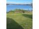 Large grassy backyard offering plenty of space for outdoor activities and lake views at 620 Georgetown Dr # 620, Casselberry, FL 32707