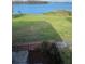 Spacious backyard with lush green grass overlooking a beautiful lake view at 620 Georgetown Dr # 620, Casselberry, FL 32707