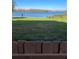 Expansive backyard with lush grass leading to a serene lake at 620 Georgetown Dr # 620, Casselberry, FL 32707