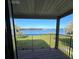 Relaxing balcony view overlooking the lush green landscape and sparkling lake at 620 Georgetown Dr # 620, Casselberry, FL 32707