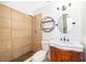 Updated bathroom with a modern vanity, oval mirror, and a tiled walk-in shower at 620 Georgetown Dr # 620, Casselberry, FL 32707