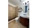 Bathroom with a shower, vanity, toilet, and tile floor at 620 Georgetown Dr # 620, Casselberry, FL 32707