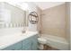 Updated bathroom with a modern vanity, large mirror, and a tiled shower-tub combo at 620 Georgetown Dr # 620, Casselberry, FL 32707
