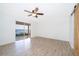 Airy bedroom with a ceiling fan, modern sliding door, and a scenic view of the water at 620 Georgetown Dr # 620, Casselberry, FL 32707