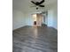 Spacious bedroom with new floor and a barn door leading to the bathroom at 620 Georgetown Dr # 620, Casselberry, FL 32707