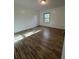 Bright and airy bedroom featuring wood-look floors and natural light at 620 Georgetown Dr # 620, Casselberry, FL 32707