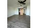 Spacious bedroom with new floor and a barn door leading to the bathroom at 620 Georgetown Dr # 620, Casselberry, FL 32707