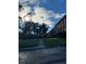 Exterior view of a well-maintained property with lush greenery and mature trees at 620 Georgetown Dr # 620, Casselberry, FL 32707