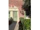 Charming townhouse entrance with a sage colored door and meticulously maintained brick facade at 620 Georgetown Dr # 620, Casselberry, FL 32707