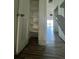 Hallway with wood floors and multiple doors at 620 Georgetown Dr # 620, Casselberry, FL 32707