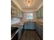 Kitchen featuring blue cabinets, granite countertops, and stainless steel appliances at 620 Georgetown Dr # 620, Casselberry, FL 32707