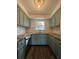 Kitchen featuring blue cabinets, granite countertops, and stainless steel appliances at 620 Georgetown Dr # 620, Casselberry, FL 32707
