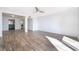 View of the living room showcasing modern wood-look tile flooring and access to the kitchen at 620 Georgetown Dr # 620, Casselberry, FL 32707
