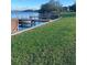Scenic waterfront view with docks, boats, and lush green grass at 620 Georgetown Dr # 620, Casselberry, FL 32707