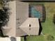 Aerial view showcases a private screened-in pool in backyard of home surrounded by green lawn at 685 Vistawilla Dr, Winter Springs, FL 32708