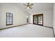 Bright bedroom featuring carpet, ceiling fan and sliding door access to outdoors at 685 Vistawilla Dr, Winter Springs, FL 32708