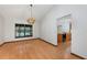 Bright dining room with wood floors, a decorative light fixture, and views of the pool at 685 Vistawilla Dr, Winter Springs, FL 32708