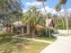 Beautiful home featuring mature trees, lush landscaping, and a stone facade at 685 Vistawilla Dr, Winter Springs, FL 32708