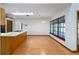 Kitchen featuring an island, granite counters, wood cabinets, stainless steel appliances, and a skylight at 685 Vistawilla Dr, Winter Springs, FL 32708