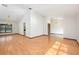 Spacious living room featuring vaulted ceilings, wood floors, and a large window overlooking the property at 685 Vistawilla Dr, Winter Springs, FL 32708