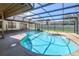 Inviting screened-in pool with a unique shape and lots of patio space at 685 Vistawilla Dr, Winter Springs, FL 32708