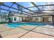 Sparkling screened-in pool with spacious patio area, ideal for outdoor entertaining at 685 Vistawilla Dr, Winter Springs, FL 32708