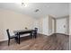 Dining room with dark wood table and chairs and wood flooring at 7319 Blue Jacket W Pl, Winter Park, FL 32792