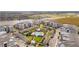 Aerial view of a community featuring a pool, clubhouse, and lush landscaping at 7517 Laureate Blvd # 4206, Orlando, FL 32827
