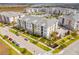 A colorful apartment complex offers a tranquil atmosphere, swimming pool, and lake views at 7517 Laureate Blvd # 4206, Orlando, FL 32827
