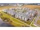 Aerial view of a modern apartment community with a pool, manicured lawns, and ample parking at 7517 Laureate Blvd # 4206, Orlando, FL 32827
