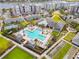 Aerial view showcasing a community pool, clubhouse, and meticulously maintained landscaping at 7517 Laureate Blvd # 4206, Orlando, FL 32827